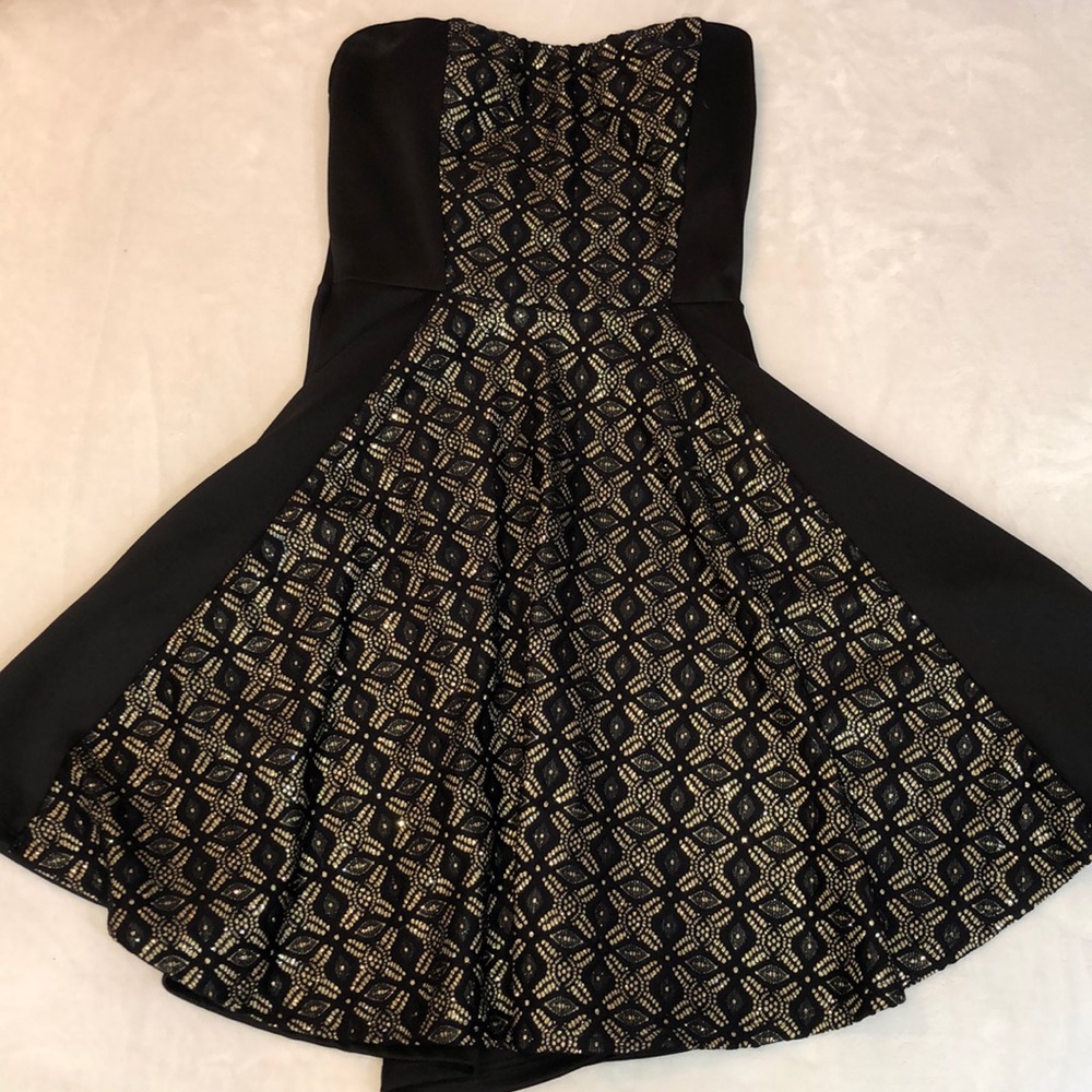 little black dress with gold details